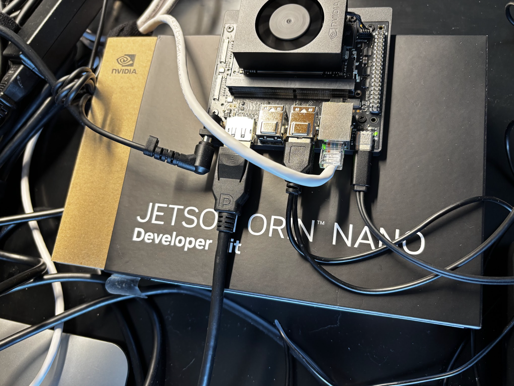 NVIDIA Jetson Nano module and carrier board with heat sink, used for edge AI prototyping alongside Raspberry Pi class devices