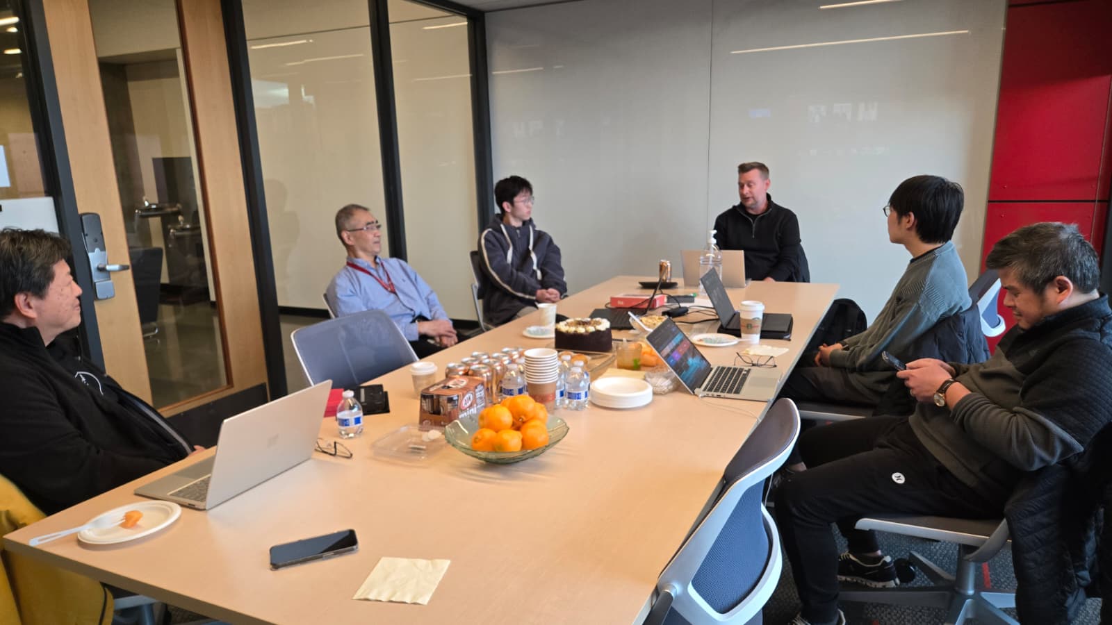 Group photo at a meet and greet: Speech2Braille collaborators from UW, partners, and community members standing together indoors