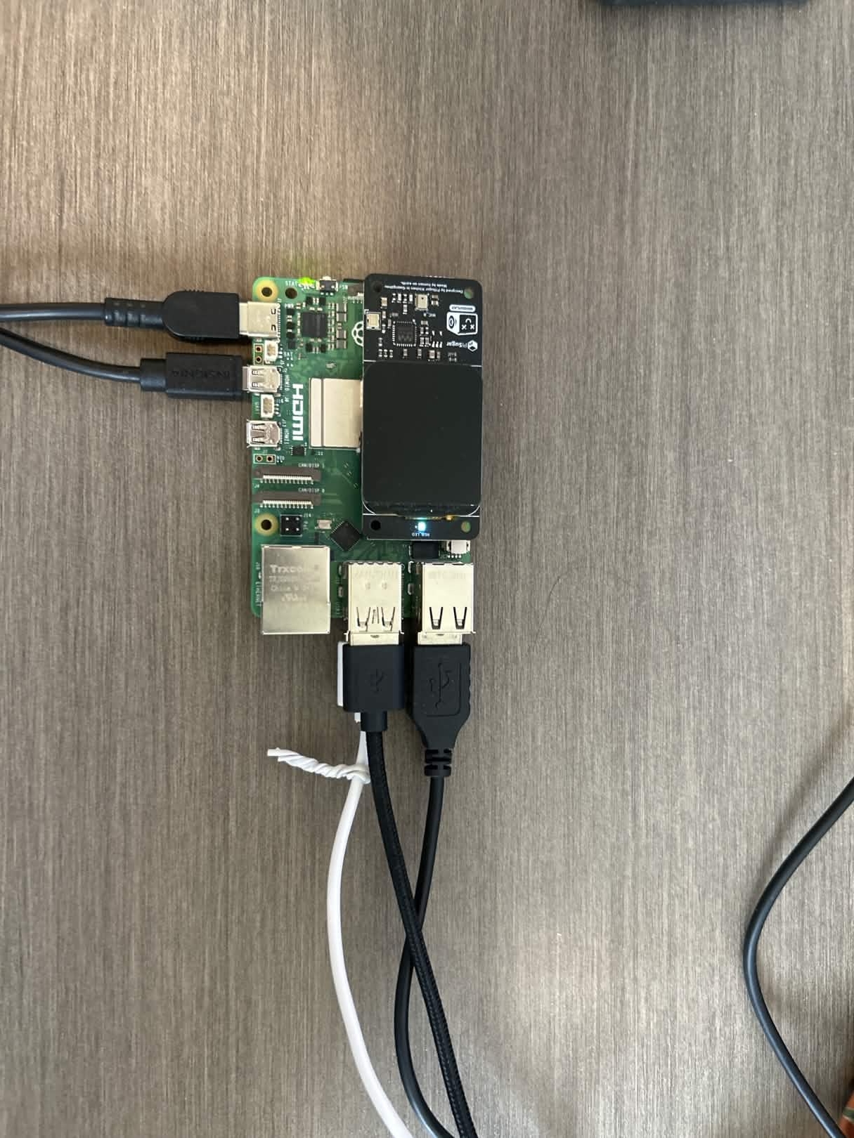 Raspberry Pi single-board computer with ports visible, representing affordable hardware for fully offline Speech2Braille deployment in schools
